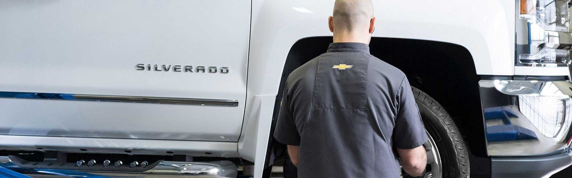 service tech working on silverado