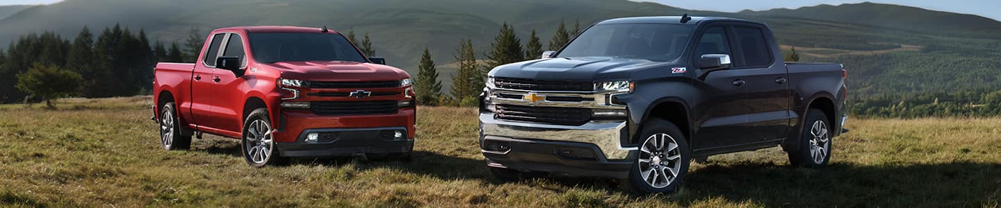 image of 2 chevy trucks